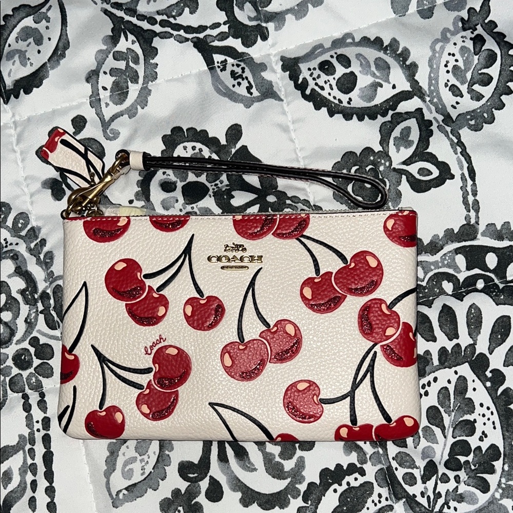 Coach Cherry Pattern Wristlet - Cream and Red with Gold hardware.